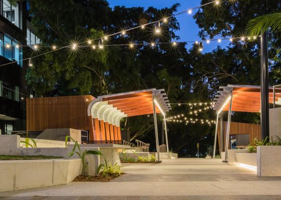 a walkway with lights from the ceiling