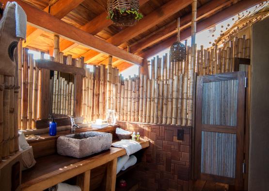 a bathroom with a bamboo wall and a sink