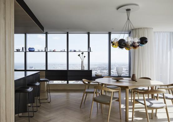 a dining room with a table and chairs