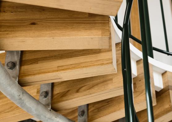 a wooden stairs with metal railings