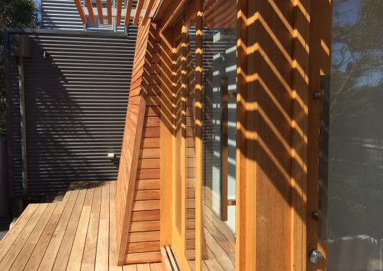 a wooden deck with a pergola