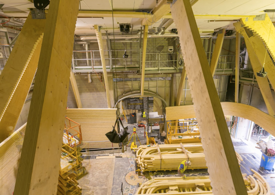 a construction site with wood beams and scaffolding