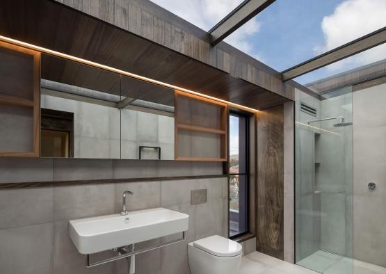 a bathroom with a glass shower and a sink