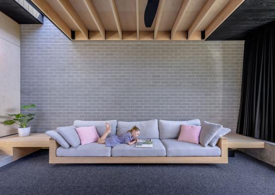 a child lying on a couch