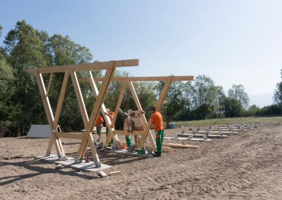 a group of men working on a structure