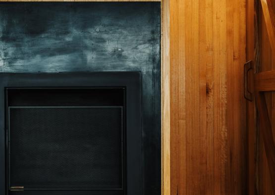 a fireplace with logs stacked in it