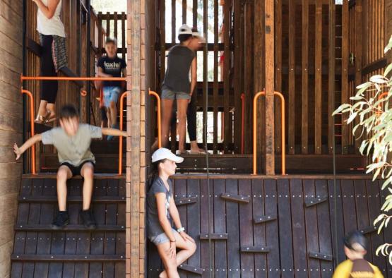 a group of people on a wooden structure