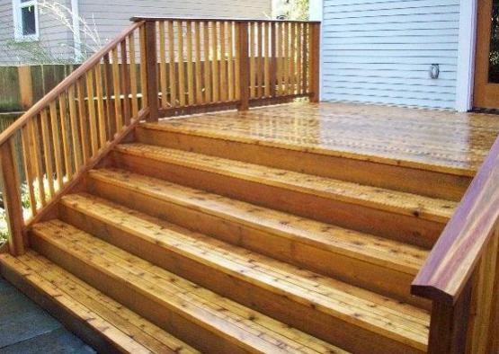 a wooden deck with railing