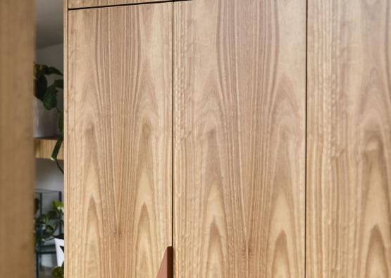 a wooden cabinet with a lightning bolt on it