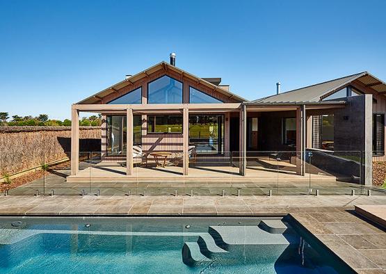 a pool in front of a house