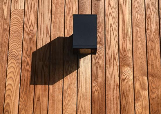 a black box on a wood deck