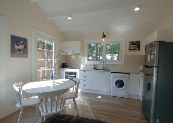 a kitchen and dining area with a table and chairs