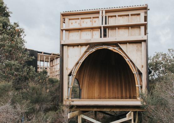 a wooden structure with a hole in the middle of it