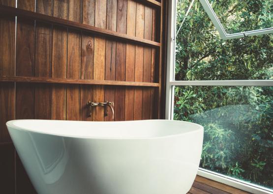 a white bathtub in a bathroom