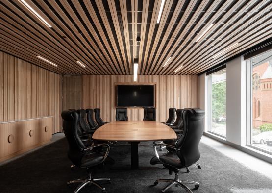 a conference room with a table and chairs