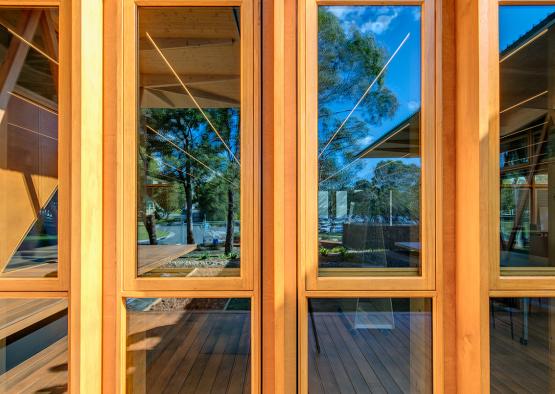 a glass doors with a wood deck