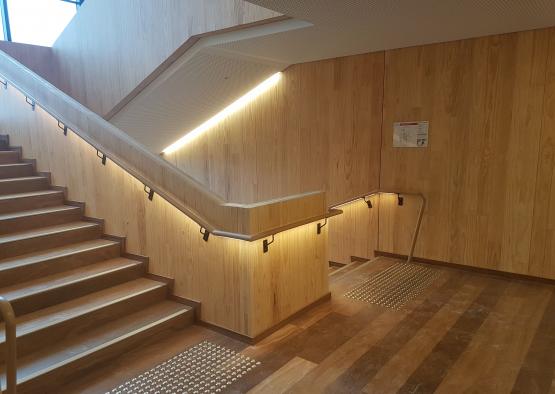 a wooden staircase with lights