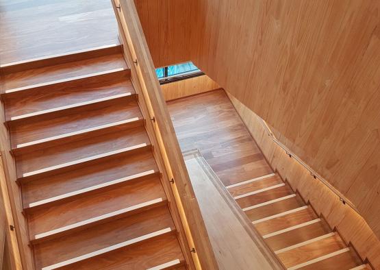 a wooden staircase with a window