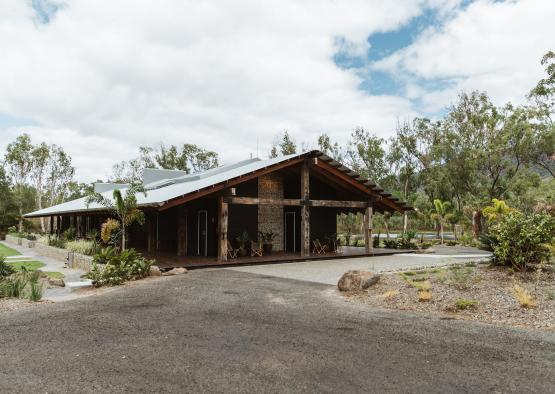 a building with a roof and trees