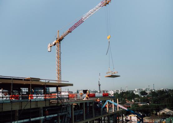 a crane lifting a piece of concrete