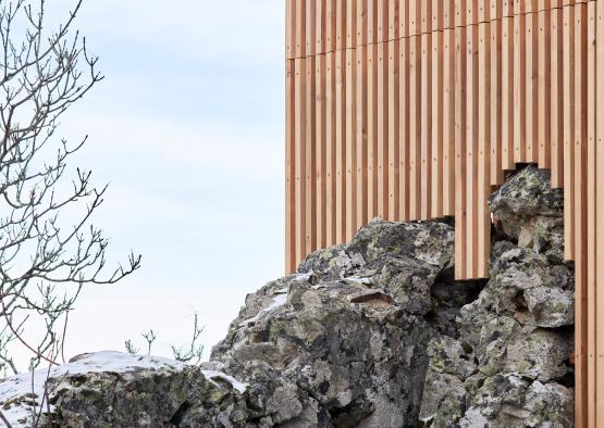 a building with a pile of rocks