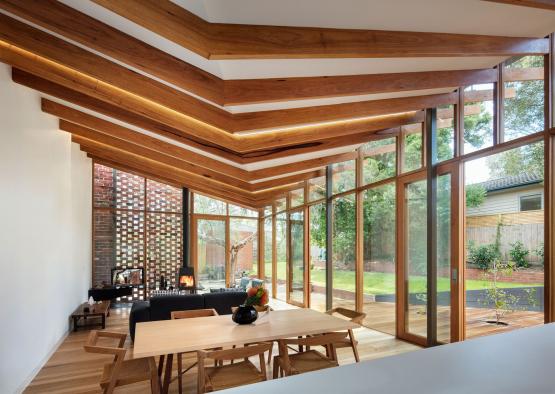 a room with a table and chairs and a fireplace