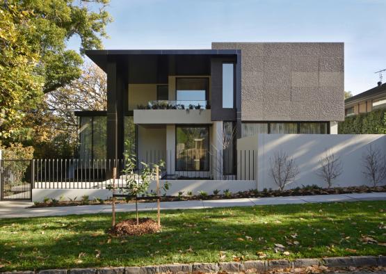 a house with a fence and grass