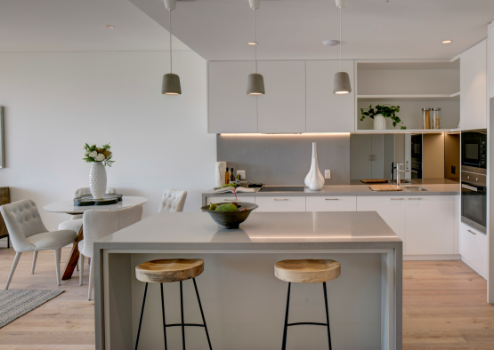 a kitchen with a table and chairs