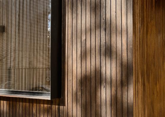 a wood wall with a window