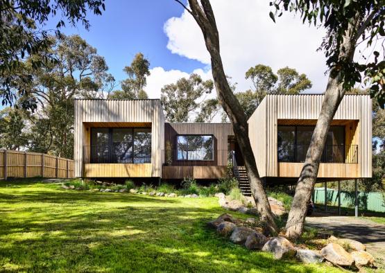 a house with trees and grass