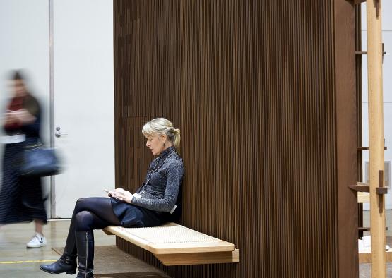 a woman sitting on a bench