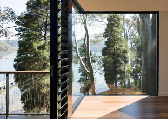 a room with a view of trees and water