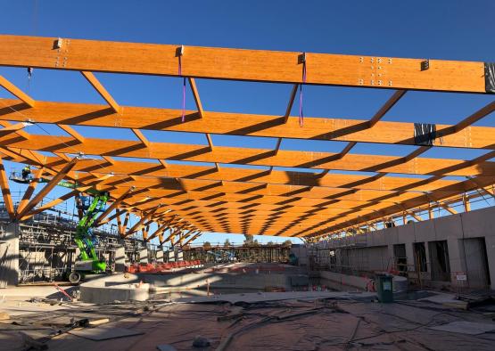 a construction site with a large wooden structure