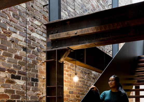 a woman standing on a staircase