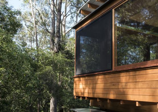 a house with a porch and trees