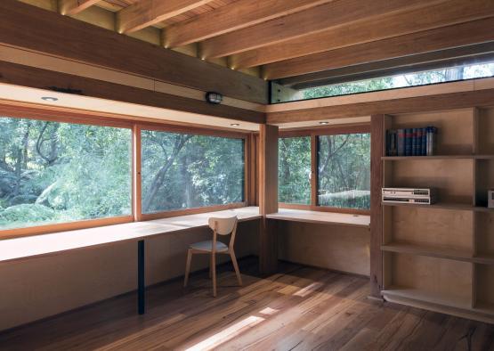 a room with a chair and shelves