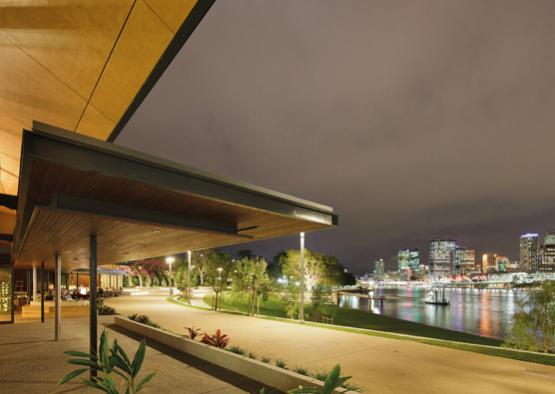 a walkway and walkway with a city in the background