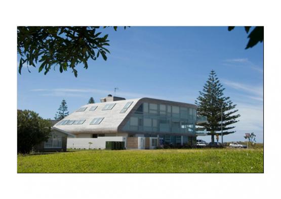 a building with a curved roof