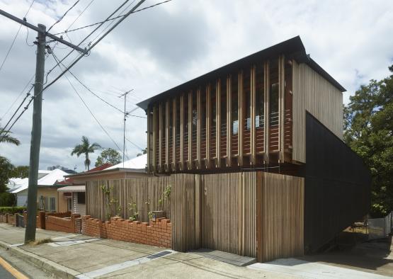 a building with a wooden fence