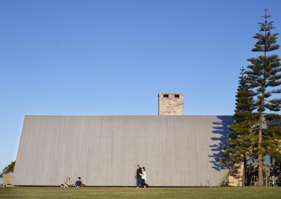 people standing in front of a wall