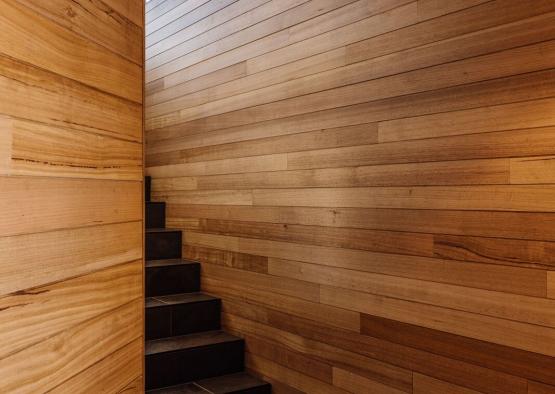 a staircase in a wood room