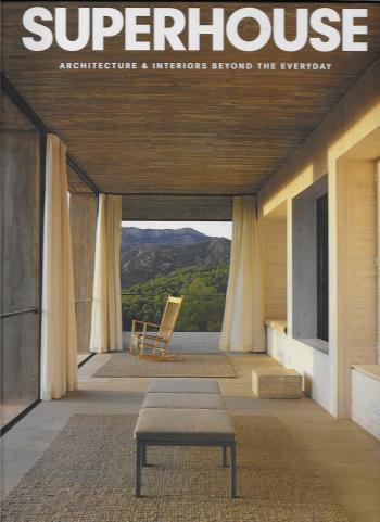 a porch with a rocking chair and a mountain view