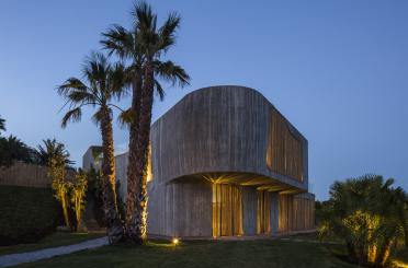 a building with trees and lights