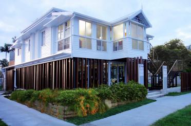 a building with a balcony and a garden