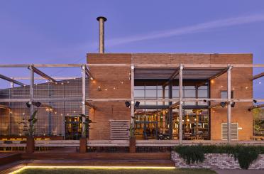 a building with a wood structure and a wood deck