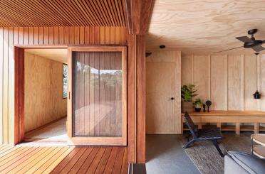 a room with a glass door and a table