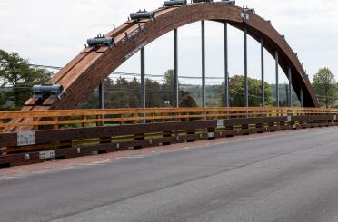 a wooden bridge with cars on it