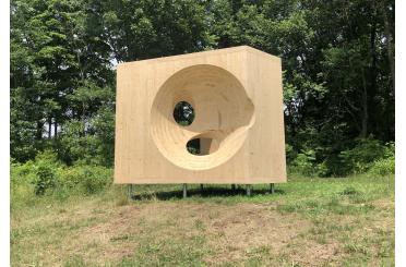 a wooden square with a hole in it