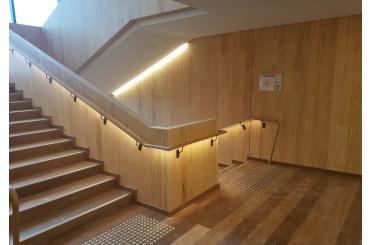 a wooden staircase with lights