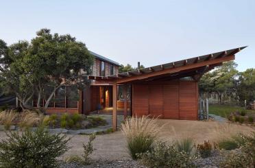 a house with a roof and a yard